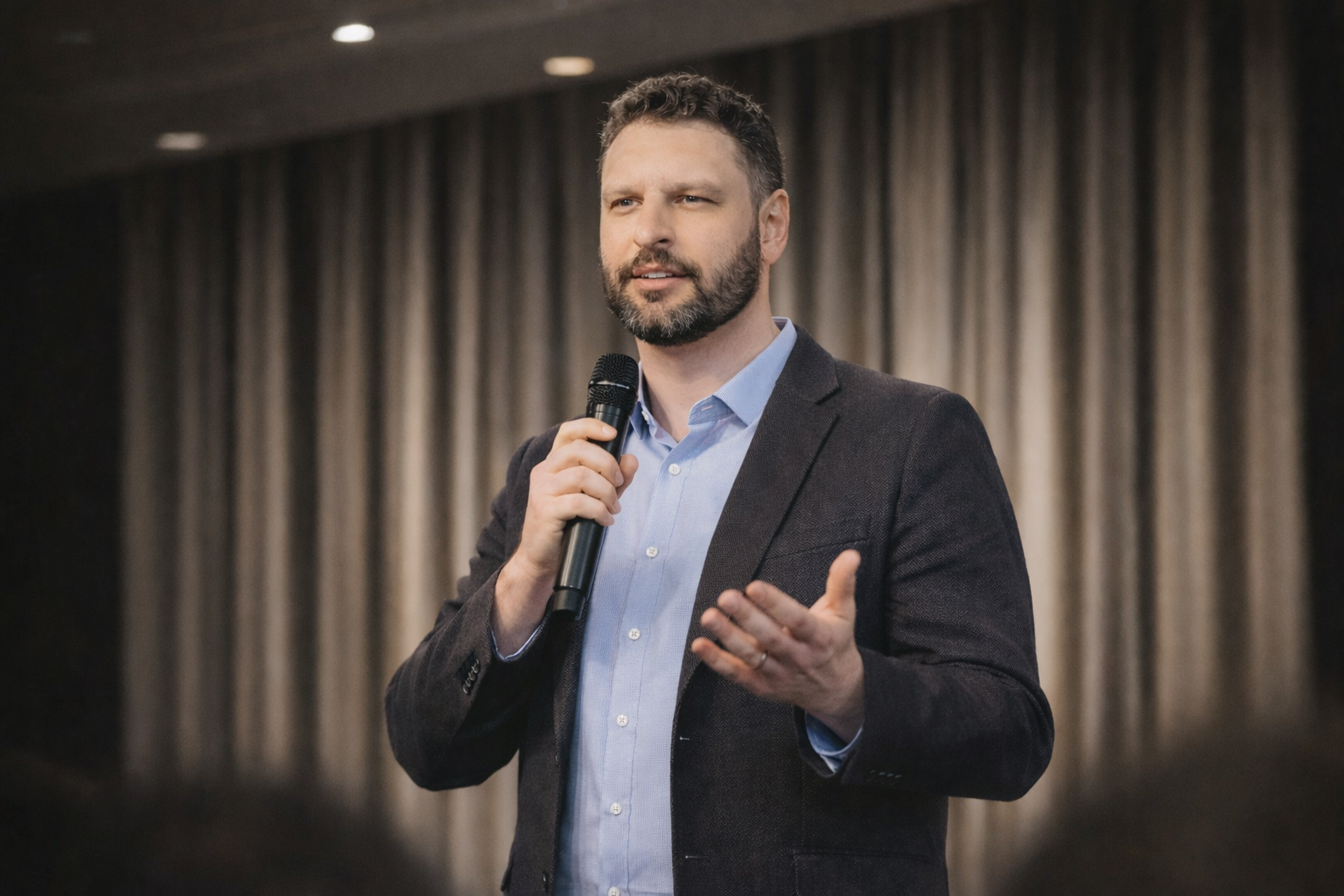 Michael Kove speaking at conference